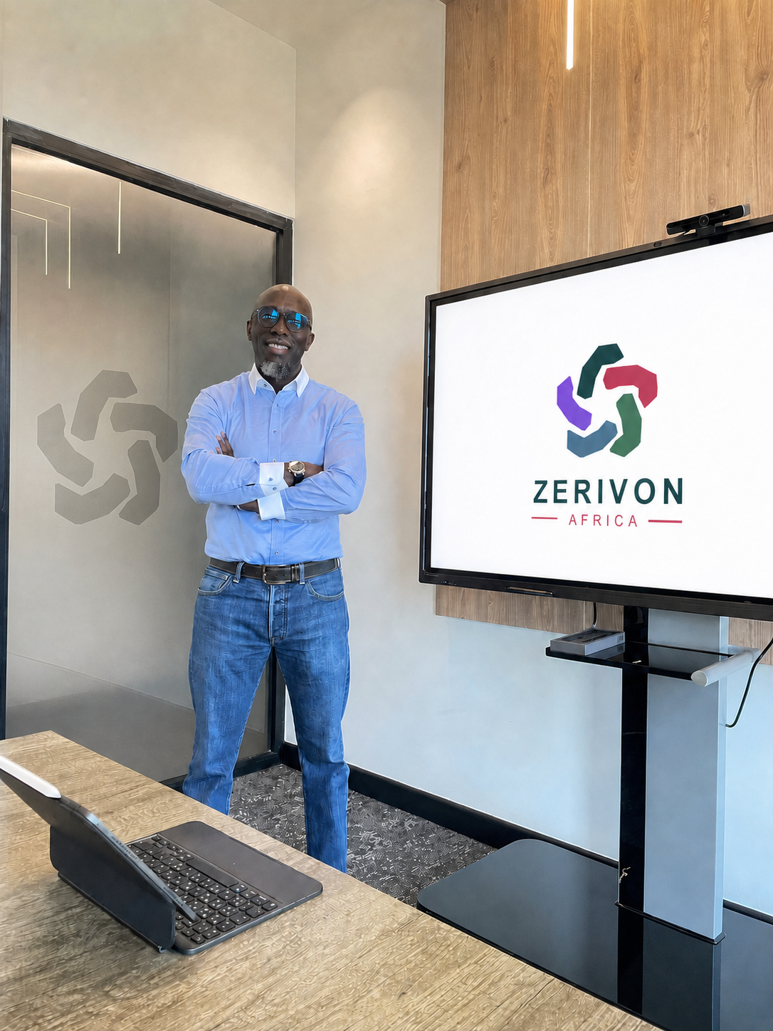 Muigai Kamau beside a presentation screen displaying the Zerivon Africa logo